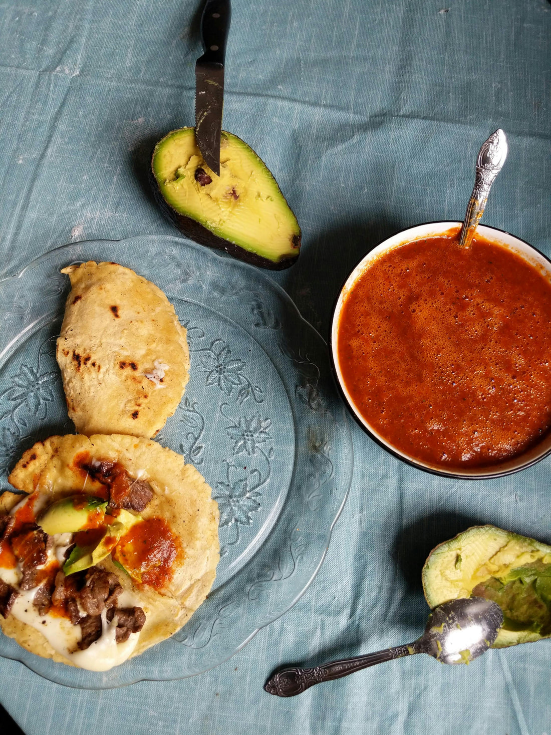 Tacos al pastor with hot sauce and fresh toppings